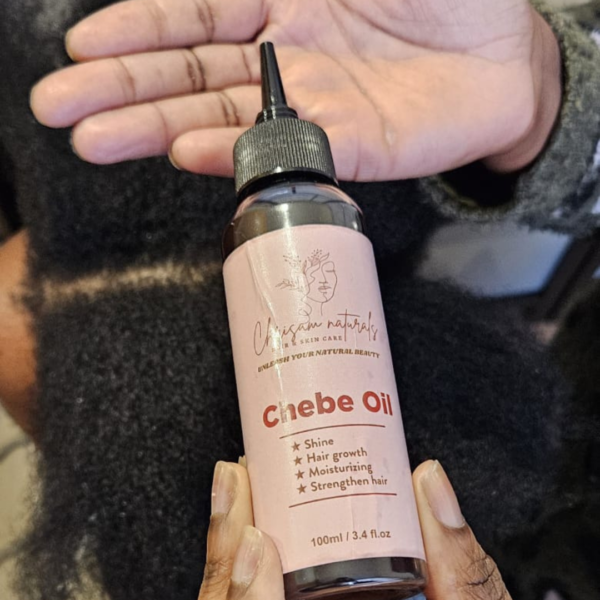 Chebe oil poured in hairdressers hand